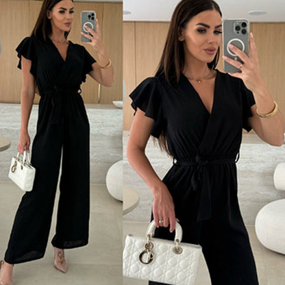 Enfärgad jumpsuit för kvinnor med V-ringning, volangärmar och vida ben